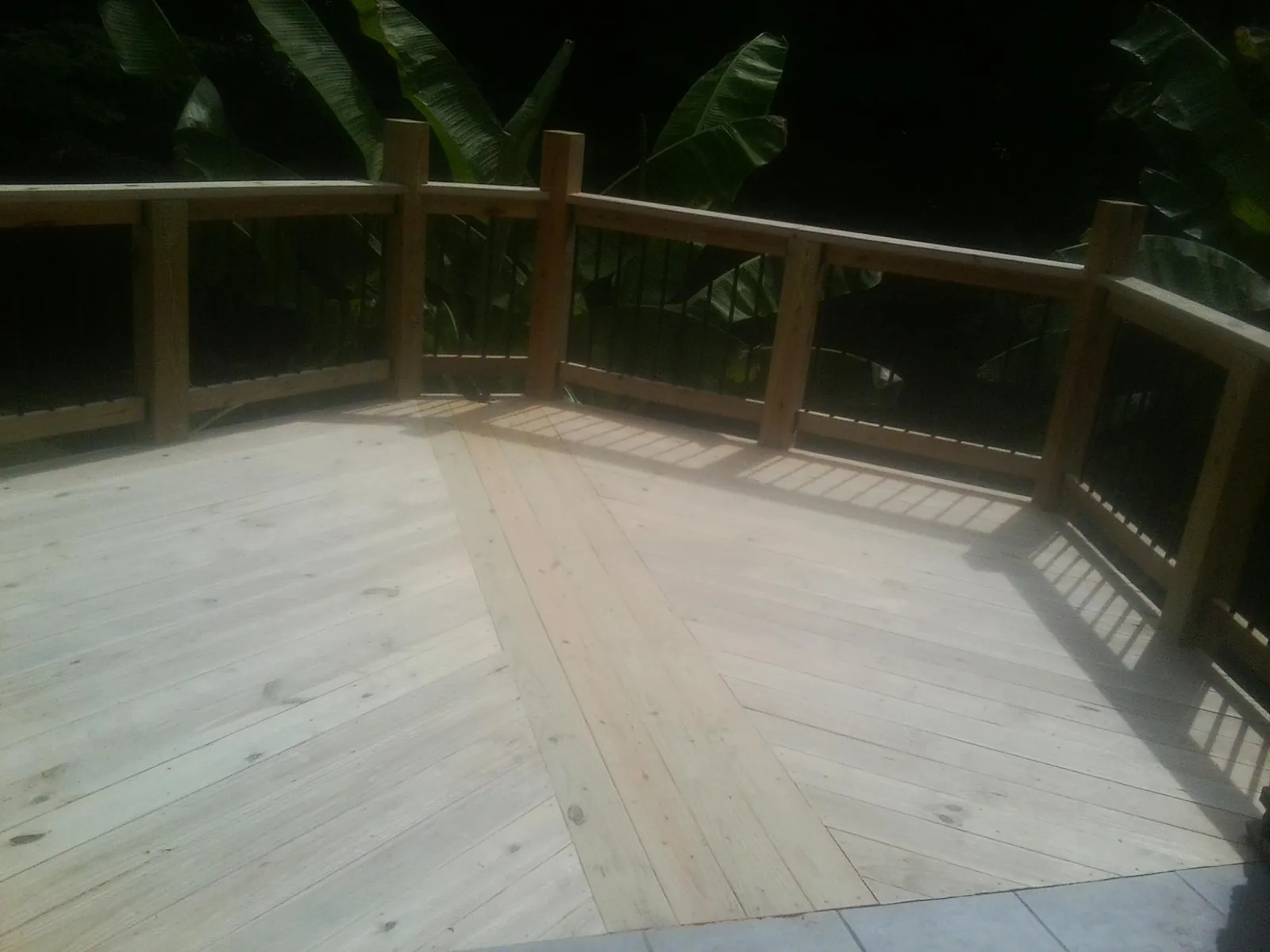 New wood deck and railing built off the back of a home in Elkton